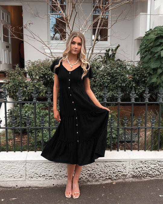 Zwarte Midi Jurk | V-Hals | Ruches Rok | Elastische Schouders | Ontspannen Pasvorm
